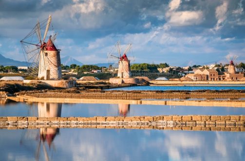 Marsala, Italy. Stagnone Lagoon with vintage windmills and saltwork, Trapani province, Sicily.